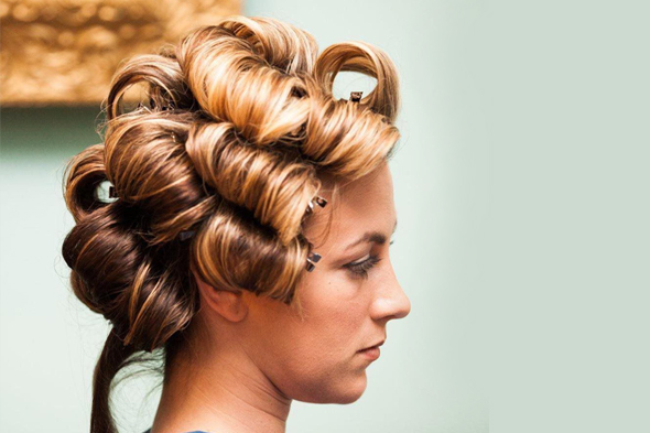 Woman getting her hair curled